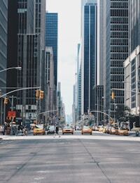 Quiet city street at dusk — understated wealth and everyday frugality